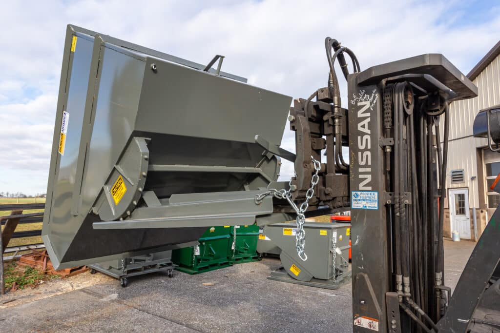 A self dumping hopper for construction